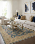 Violet Agra Blue and Gold Hand Knotted Wool area rug styled in an elegant airy living room with white sofa and brass accents - lifestyle photo