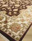 Ella Isla Multicolor Hand Knotted Wool & Silk Rug, a vibrant splash of color and texture, sits beautifully on a polished floor, showcasing its intricate hand-knotted construction.