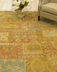Mira Agra Multicolor Hand Knotted Wool Rug, vibrant hues dance across a meticulously hand-knotted wool surface, seen elegantly displayed within a bright, modern living space.