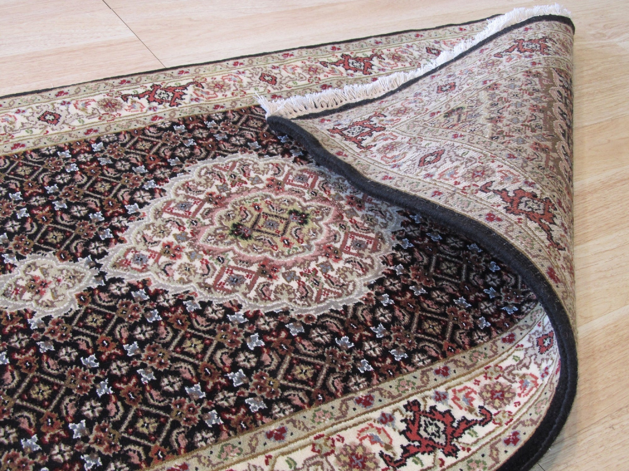 Ophelia Amara Brown Hand Knotted Wool Rug, a warm, earthy brown wool rug with a subtle, intricate hand-knotted design, graces a modern living space.
