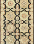Isolated view of Timeless Agra Black Hand Knotted Wool Rug, showcasing its intricate floral and geometric design.