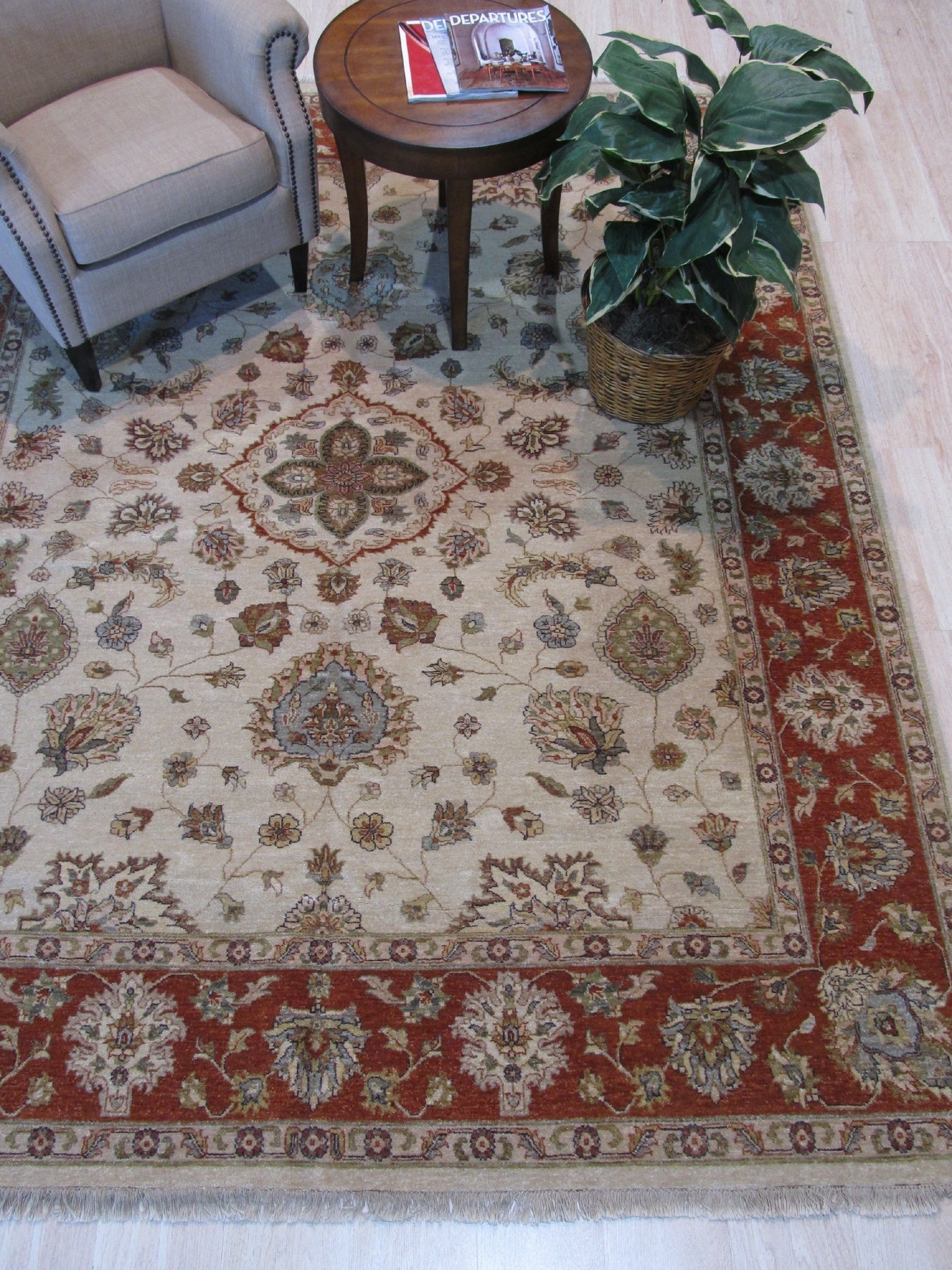 Exquisite Agra Multicolor Hand Knotted Wool Rug displays a vibrant tapestry of jewel-toned hues and intricate floral patterns, its plush wool texture inviting touch, seen in a cozy living space.