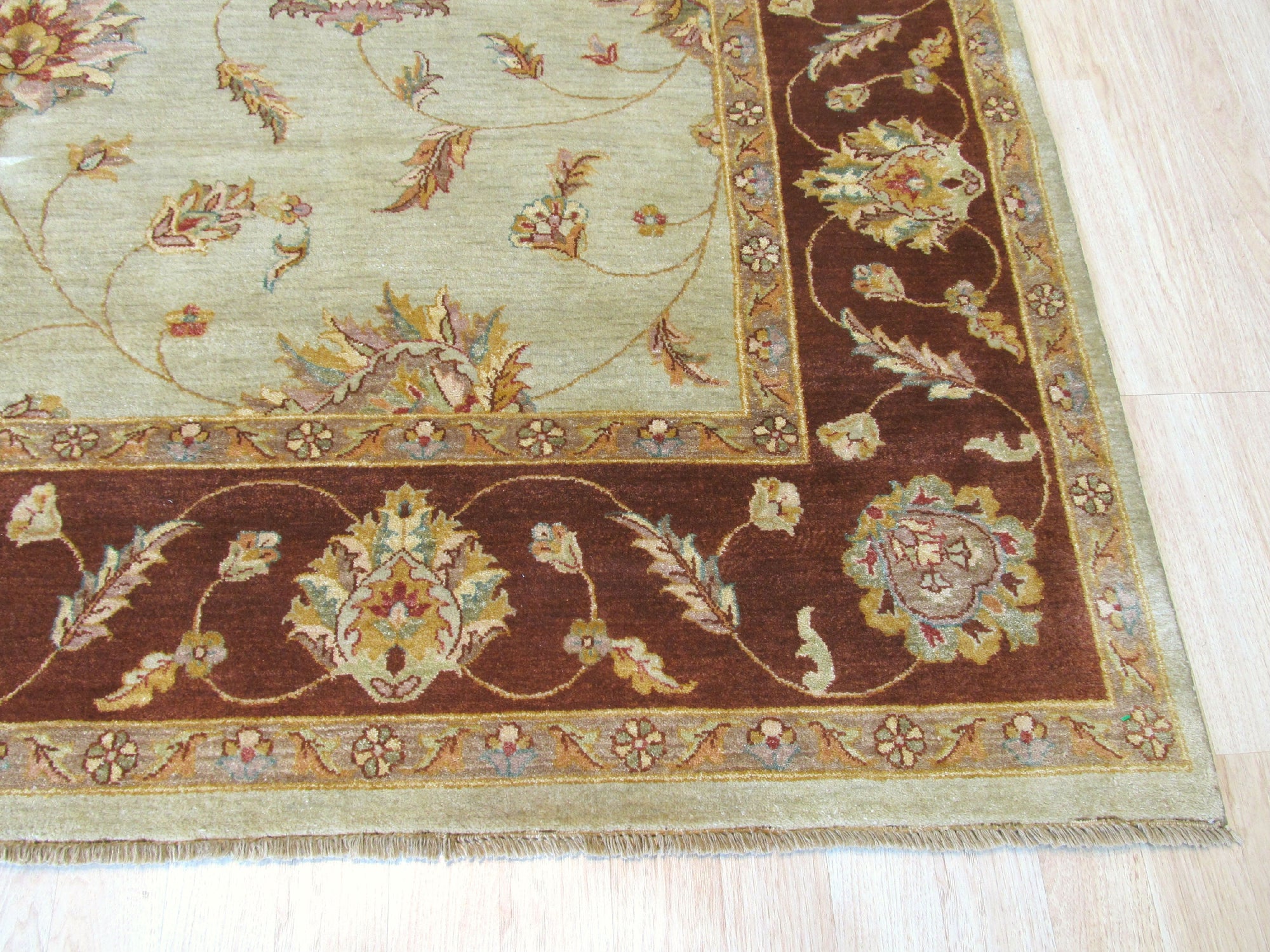 Alluring Artisan Multicolor Hand Knotted Wool Rug, vibrant hues dance across hand-knotted wool, creating an inviting warmth in this interior setting.