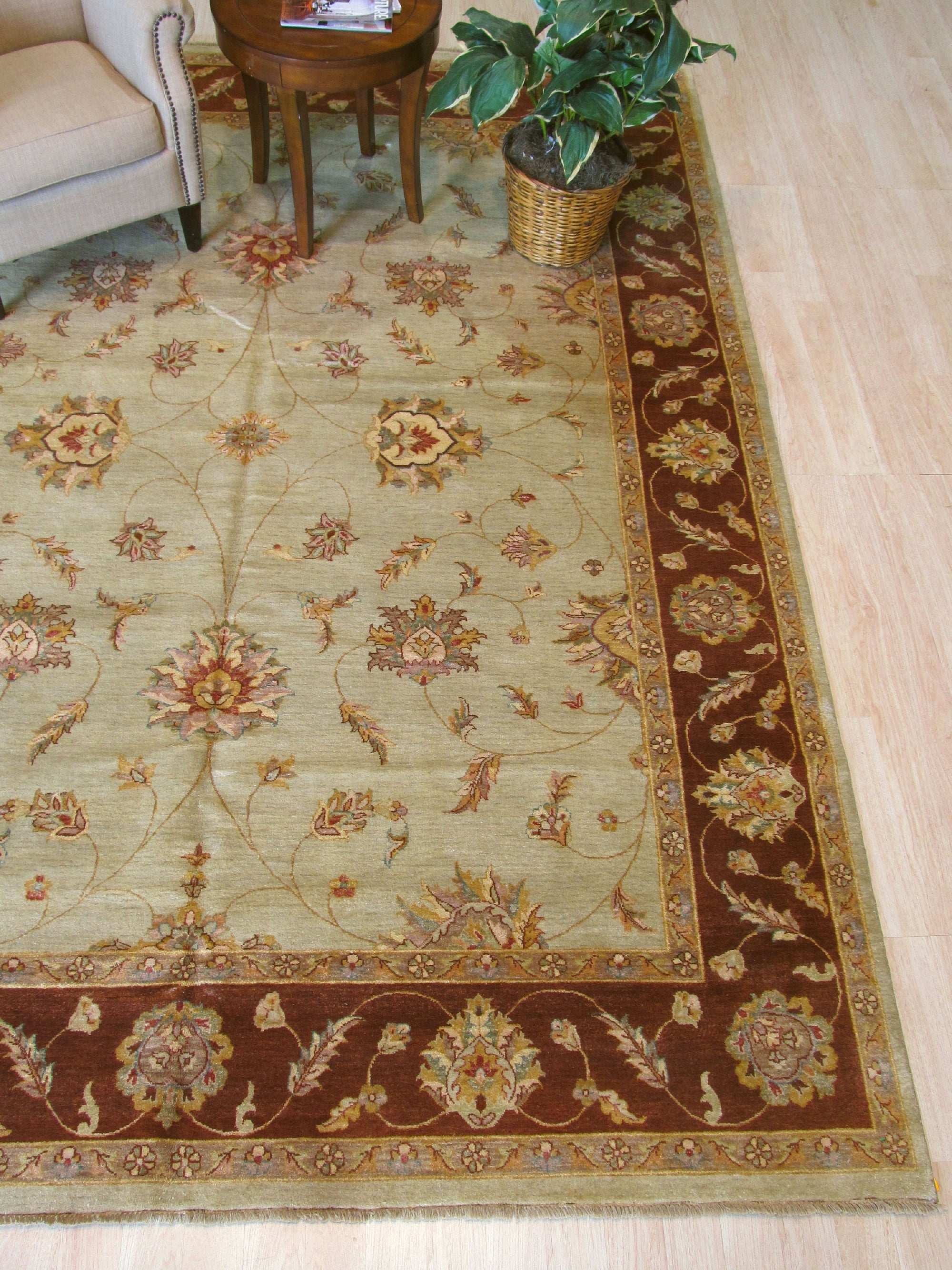 Alluring Artisan Multicolor Hand Knotted Wool Rug, showcasing vibrant hues woven into an intricate hand-knotted design, rests on a polished floor under soft light.