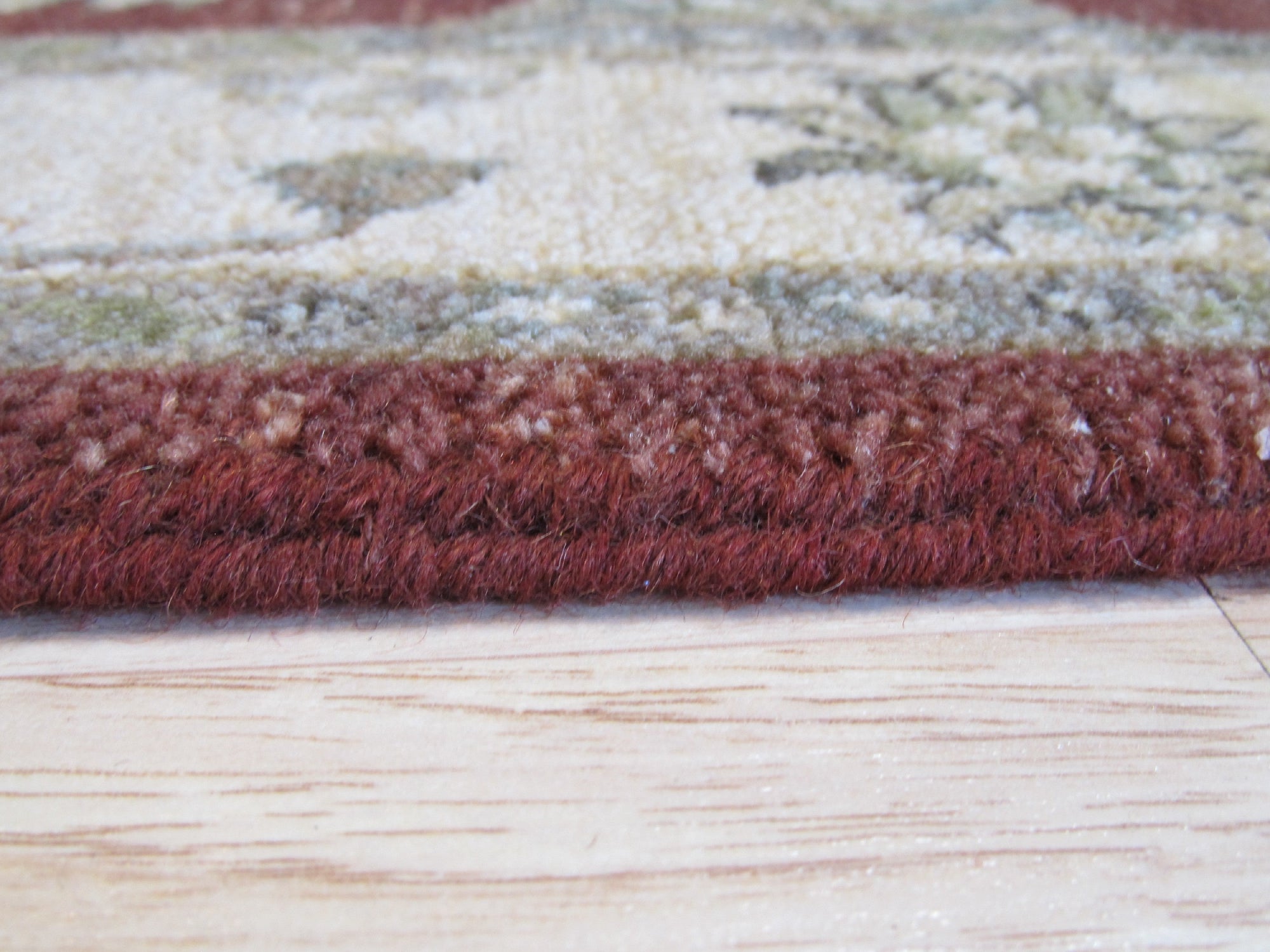 Timeless Oushak Red Hand Knotted Wool Rug, displaying intricate floral motifs and geometric patterns in warm reds and creams, softening a casually elegant living space.