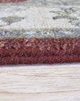 Timeless Oushak Red Hand Knotted Wool Rug, displaying intricate floral motifs and geometric patterns in warm reds and creams, softening a casually elegant living space.