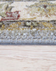 Zinnia Agra Green Hand Knotted Wool Rug, showcasing its intricate floral pattern in vibrant greens and subtle earth tones, enriching a warmly lit living space.