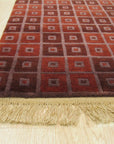 Sarrah Serene Multicolor Hand Knotted Wool Rug, vibrant colors dance across a hand-knotted wool field, seen in a lifestyle setting showcasing its texture and pattern.