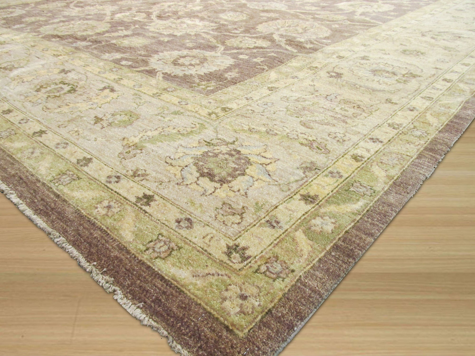 Unique Peshawar Beige Hand Knotted Wool Rug, its intricate patterns and warm beige tones complementing a modern living space with hardwood floors.