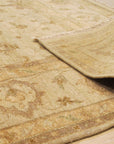 Iris Peshawar Multicolor Hand Knotted Wool Rug displayed on a hardwood floor; vibrant hues blend in a traditional design.