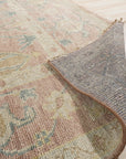 Timeless Oushak Pink Hand Knotted Wool Rug, showcasing a soft pink hue and intricate floral design, adds warmth to a light-filled living space.