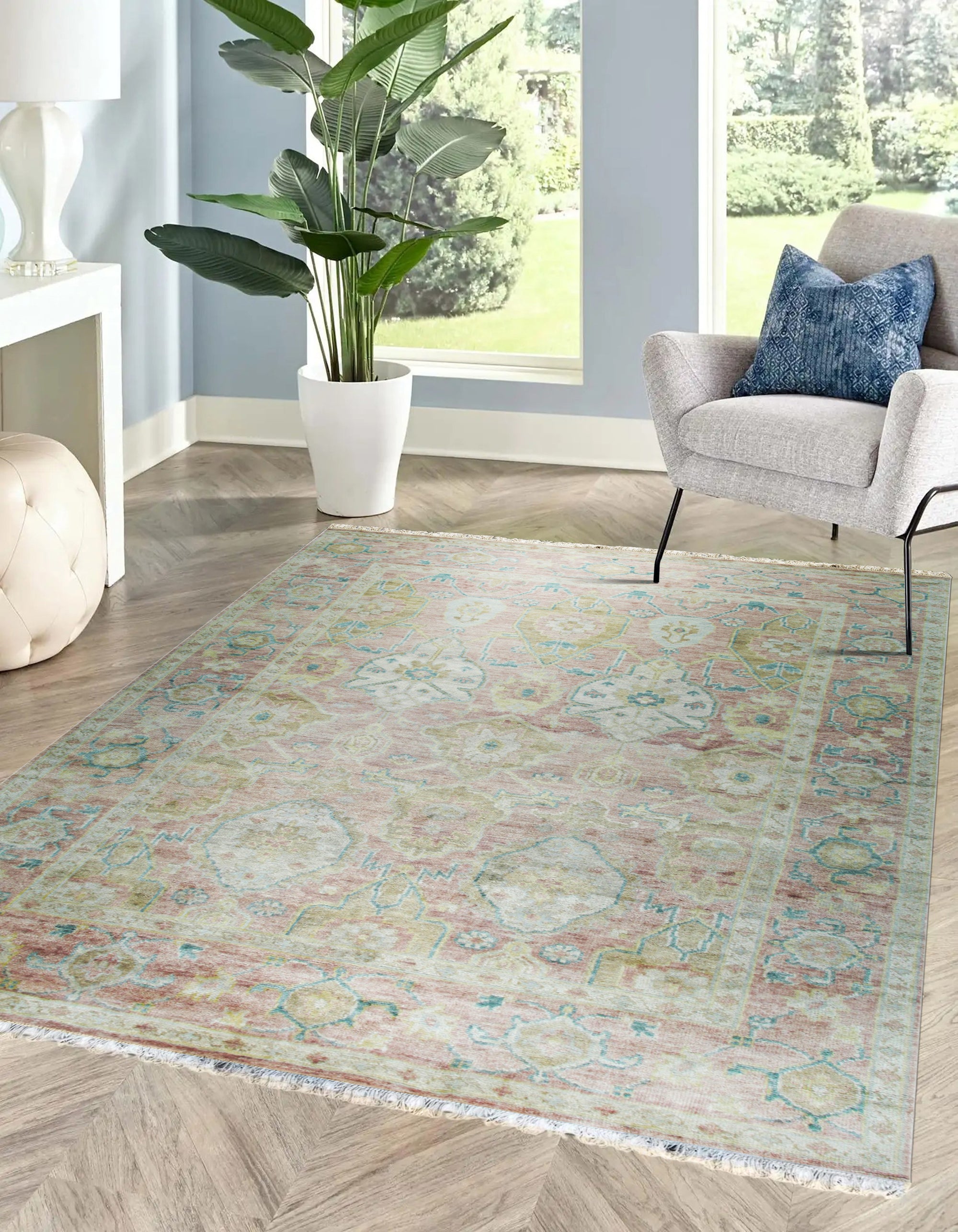 Timeless Oushak Pink Hand Knotted Wool Rug, its delicate blush tones and intricate floral patterns lending warmth and elegance to a bright, modern living space.