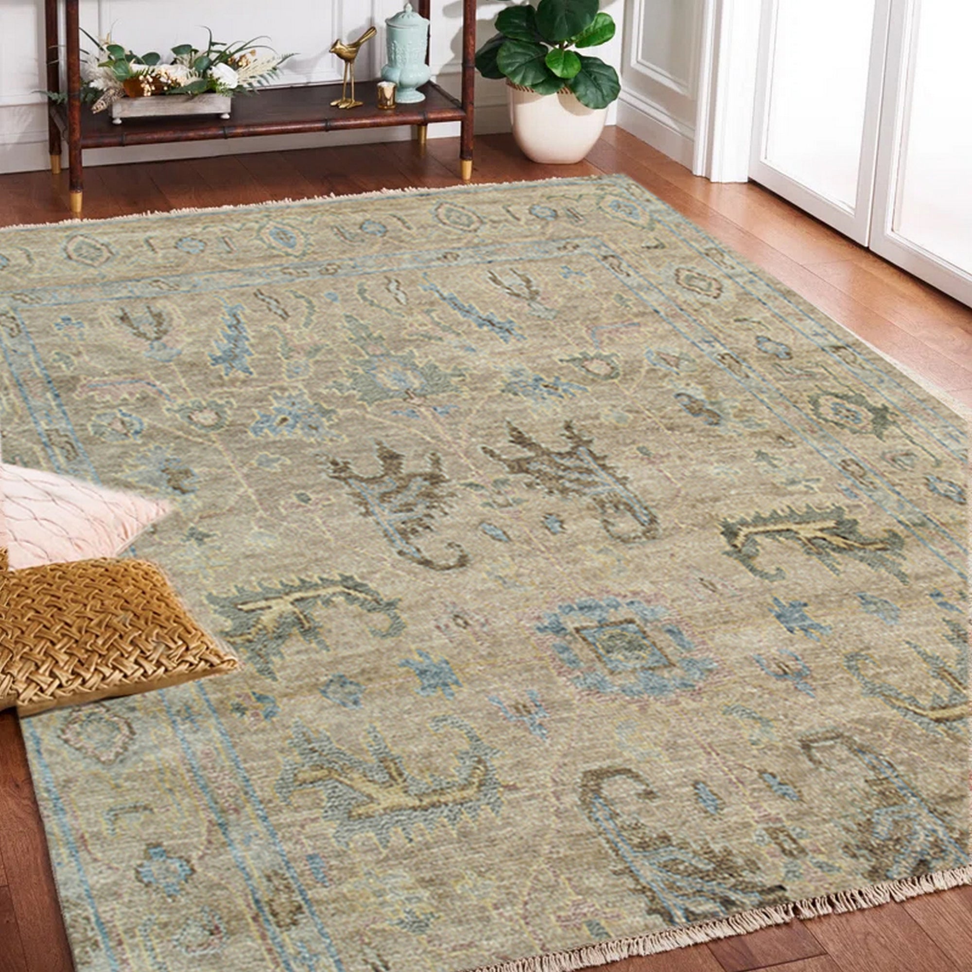Captivating Traditional Beige Hand Knotted Wool Rug, a beige wool rug with an intricate traditional design, seen in a bright living room setting with natural light highlighting its texture.