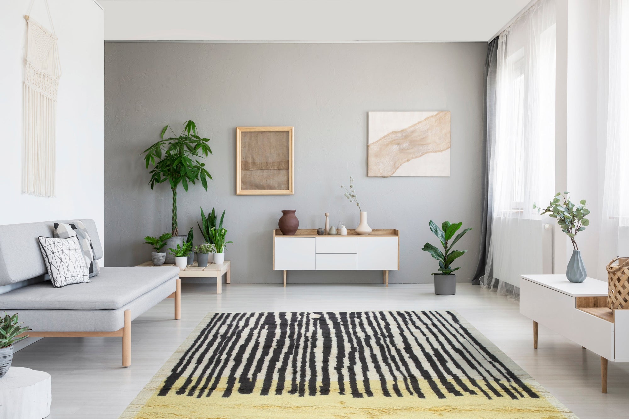 Mira Iris Yellow Hand Knotted Wool Rug, its vibrant yellow hues and intricate hand-knotted wool construction displayed within a well-lit interior setting.