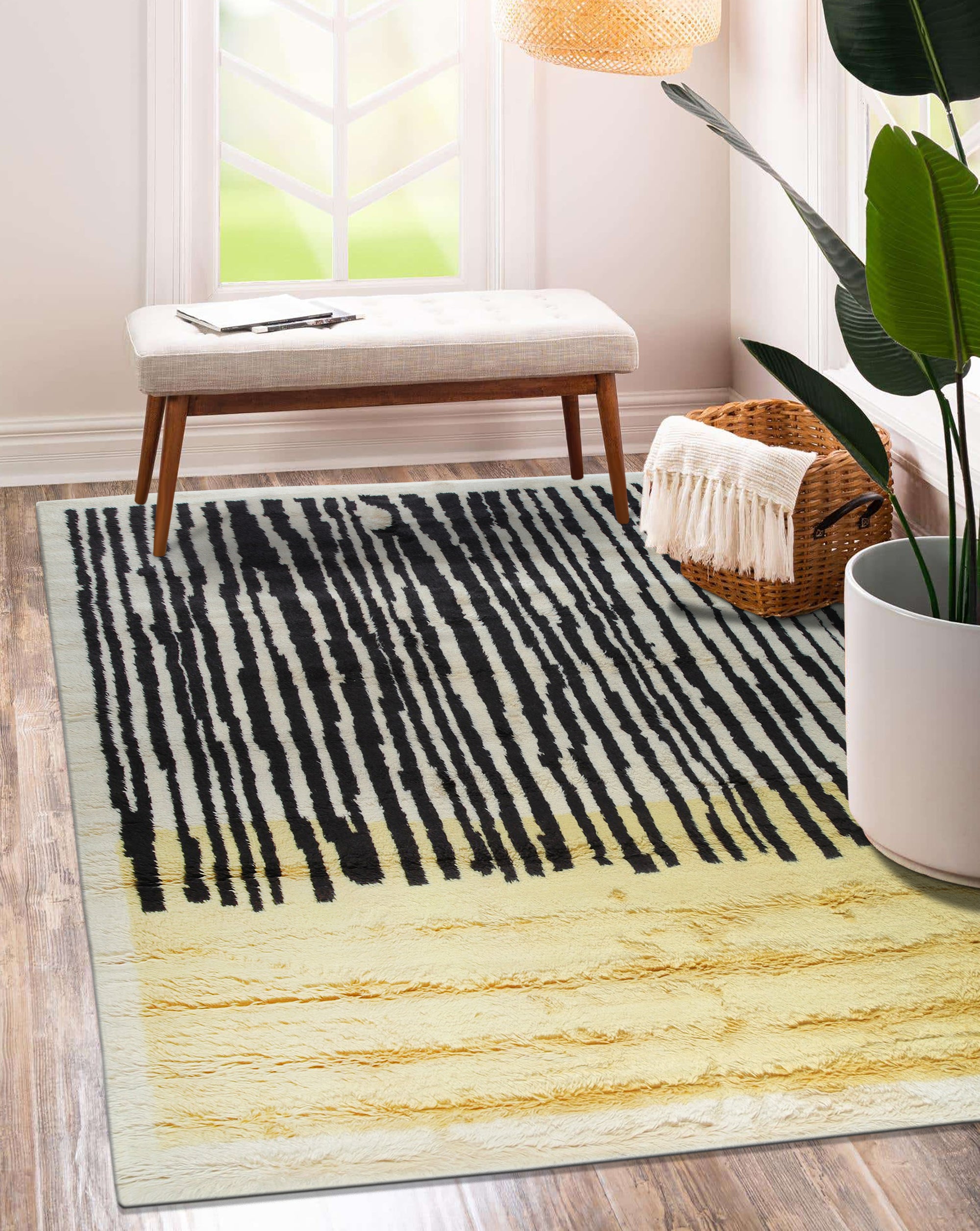 Mira Iris Yellow Hand Knotted Wool Rug, vibrant warmth radiating from its hand-knotted wool construction, infuses a room with sunshine yellow hues and an abstract design.