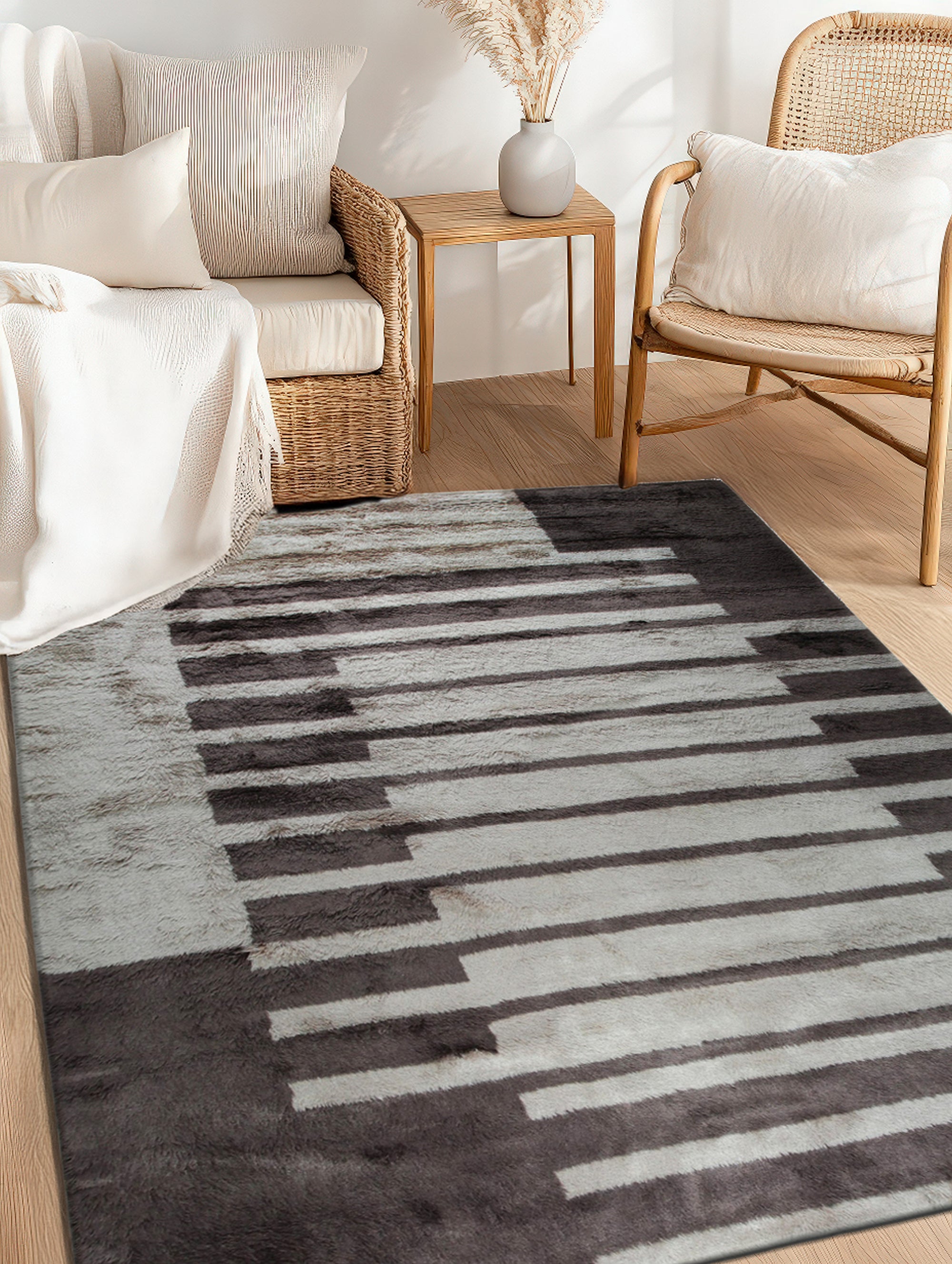 Nadia Mira Brown Hand Knotted Wool Rug displayed in a warmly lit room, its intricate brown and cream patterns complementing the neutral decor.
