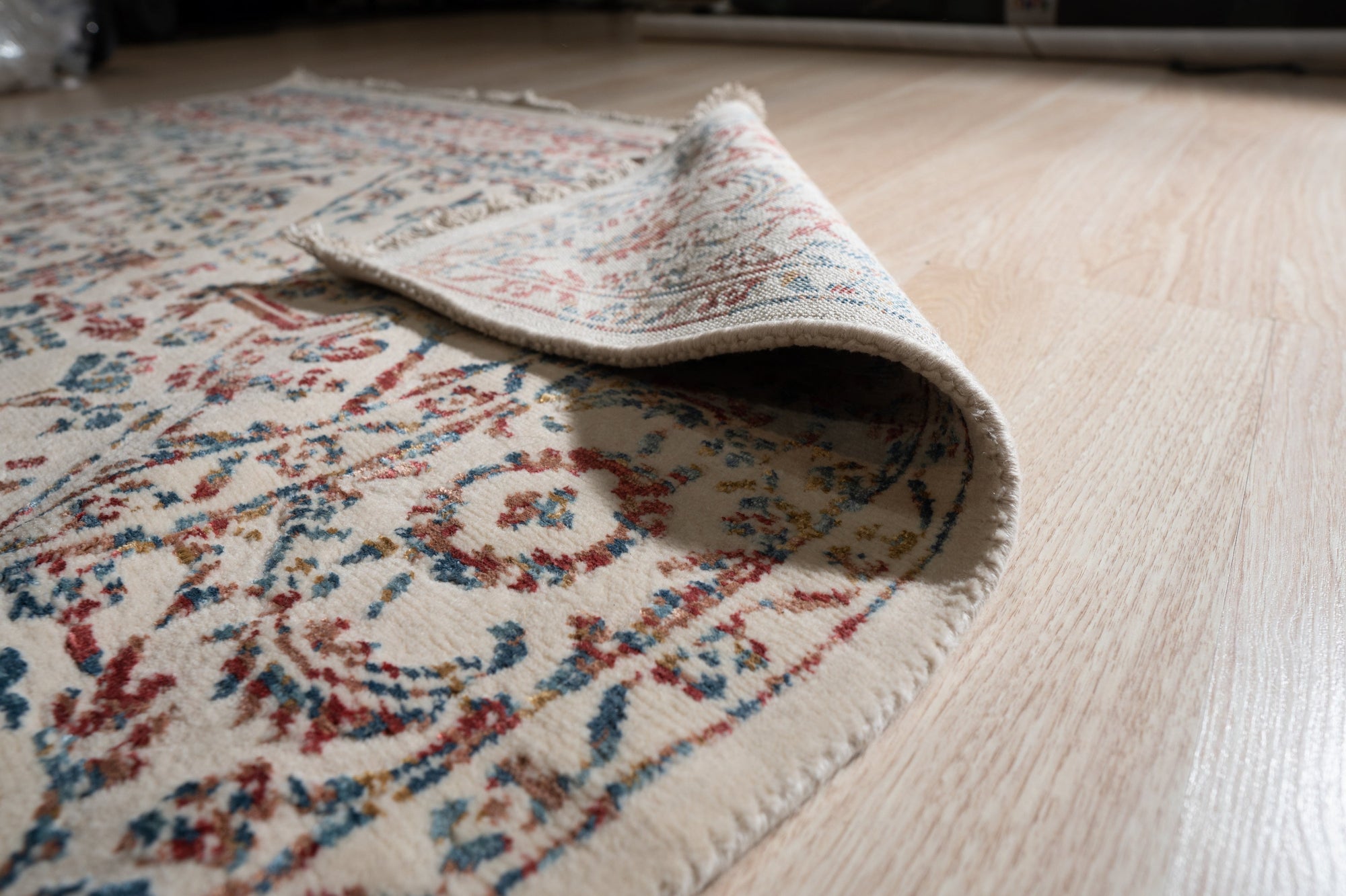 Lila Chic Multicolor Hand Knotted Wool & Viscose Rug, a vibrant burst of color and texture, lays elegantly in a modern living space, its intricate hand-knotted design adding warmth and sophistication.