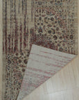 Exquisite Bianca Red Machine Made Wool & Viscose Rug displays intricate patterns in shades of red, likely showcasing wool and viscose construction with machine-made precision, viewed in a styled interior setting.