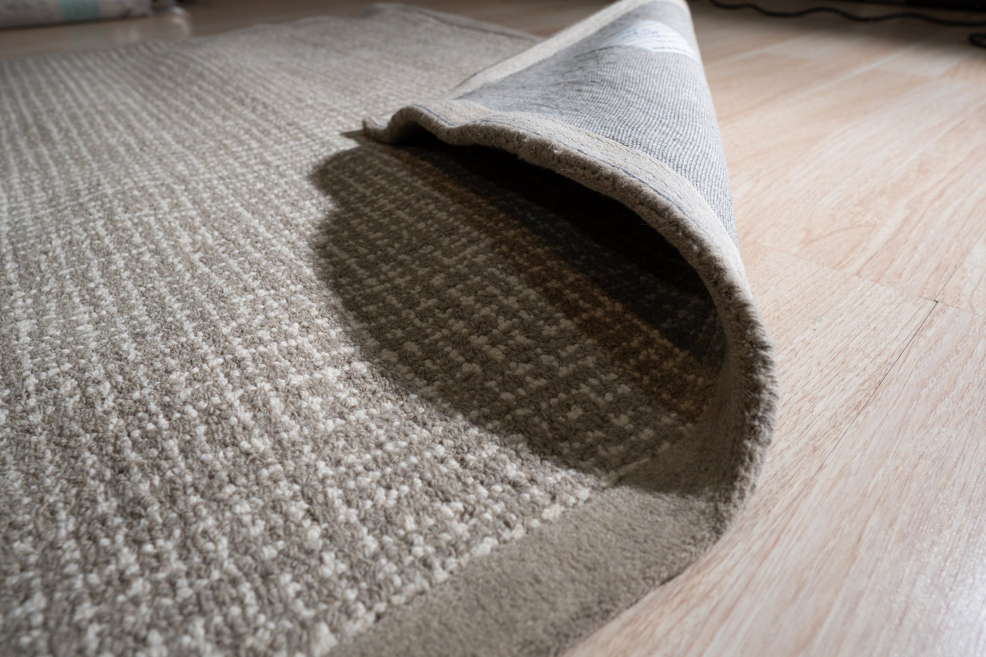 Cozy Willow Brown Hand Tufted Wool Rug, a rich brown hand-tufted wool rug lending warmth to a living space with neutral furniture and natural light.