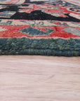 Refined Chic Green Hand Knotted Wool Rug, with its verdant hues and intricate design, graces a light-filled living space. Hand-knotted wool construction offers texture and depth, complementing neutral furniture and adding sophisticated warmth to the room.