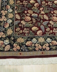 Delicate Traditional Multicolor Hand Knotted Wool Rug, vibrant hues and intricate patterns dancing across its hand-knotted wool surface, fills the frame with warmth and texture.