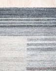 Classic Artistic Gray Flatweave Wool & Viscose Rug, displaying its subtle gray tones and flatweave construction in a modern living room setting.