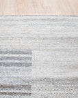 Classic Artistic Gray Flatweave Wool & Viscose Rug, showcasing a textural interplay of gray tones in a flatweave construction, resting on a light wood floor.