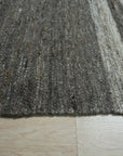 Cassandra Clara Brown Flatweave Wool Rug, warming a neutral space with its textured, earth-toned flatweave.