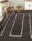 Talia Delicate Brown Flatweave Wool Rug, warming a modern living room; close-up reveals the rug's subtle brown tones and flatweave construction under natural light.