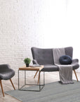 Clara Unique Gray Flatweave Wool & Viscose Rug, its cool gray tones and subtle texture adding sophistication to a bright living space.