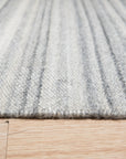 Clara Unique Gray Flatweave Wool & Viscose Rug, showcasing a subtle, sophisticated gray flatweave design in a contemporary living space.