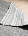 Clara Unique Gray Flatweave Wool & Viscose Rug, showcasing subtle striations and a low-profile weave in a bright, naturally lit room.