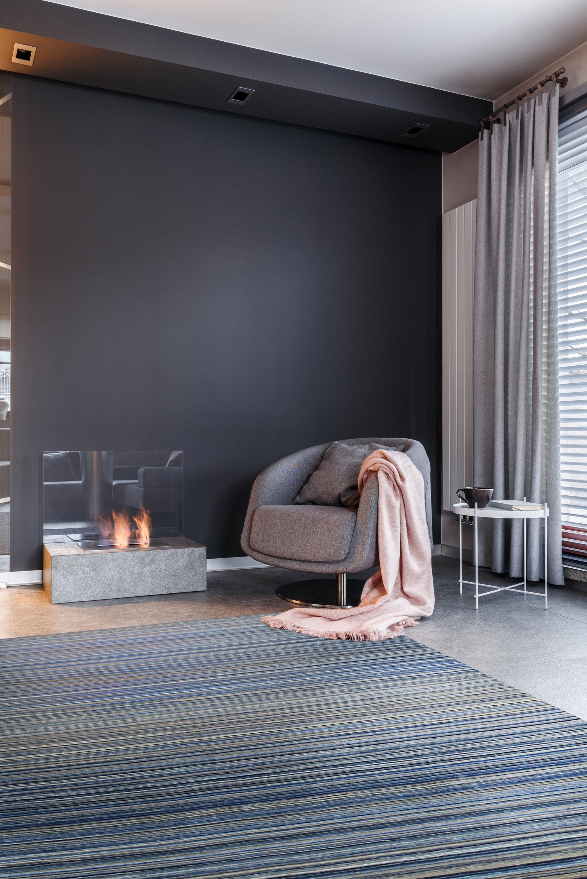 Freya Alluring Blue Handmade Rug, displaying intricate patterns and varying blue hues in a detailed floor covering.