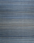 Isolated view of Freya Alluring Blue Handmade Rug, showcasing its mesmerizing abstract design with swirling blues and hints of cream.