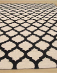 Maya Moroccan Black Flatweave Wool Rug, showcasing its geometric diamond pattern in deep black, flatwoven for a textured, minimalist aesthetic.