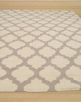 Maya Moroccan Ivory Flatweave Wool Rug, a textural landscape of geometric motifs in soft ivory wool, lends warmth and subtle pattern to a living space.