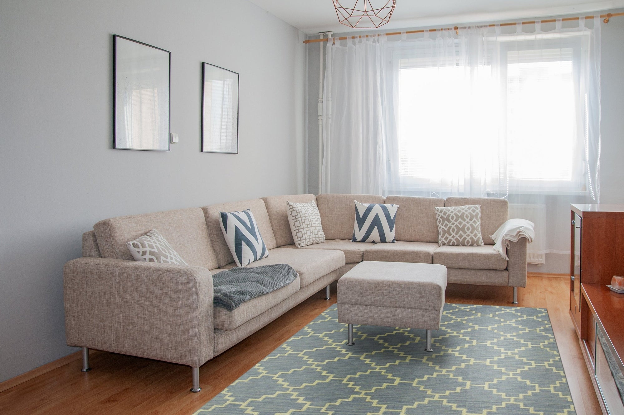 Ruby Moroccan Blue Flatweave Wool Rug, showcasing its intricate geometric pattern in shades of blue against a neutral backdrop. The rug's flatweave construction and wool material are clearly visible, highlighting its texture.