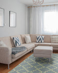 Ruby Moroccan Blue Flatweave Wool Rug, showcasing its intricate geometric pattern in shades of blue against a neutral backdrop. The rug's flatweave construction and wool material are clearly visible, highlighting its texture.