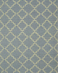Isolated view of Ruby Moroccan Blue Flatweave Wool Rug, showcasing its geometric diamond lattice design in shades of blue, cream, and soft red.