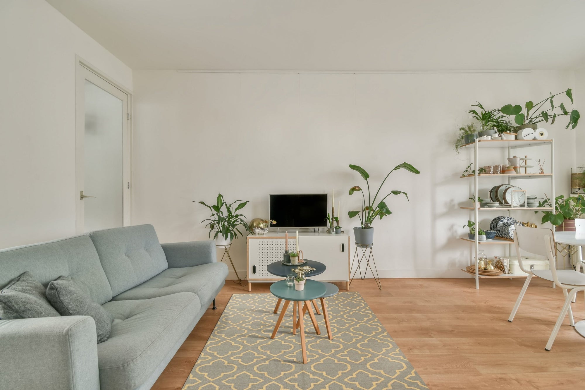Luna Nadia Blue Flatweave Wool Rug in a bright living room setting; vibrant blues and creams dance across the flatweave wool, grounding the space with a modern, airy feel.