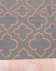 Luna Nadia Blue Flatweave Wool Rug, a cool-toned blue and ivory wool rug with a geometric pattern and flatweave construction, laid on a light hardwood floor showcasing its texture and scale.