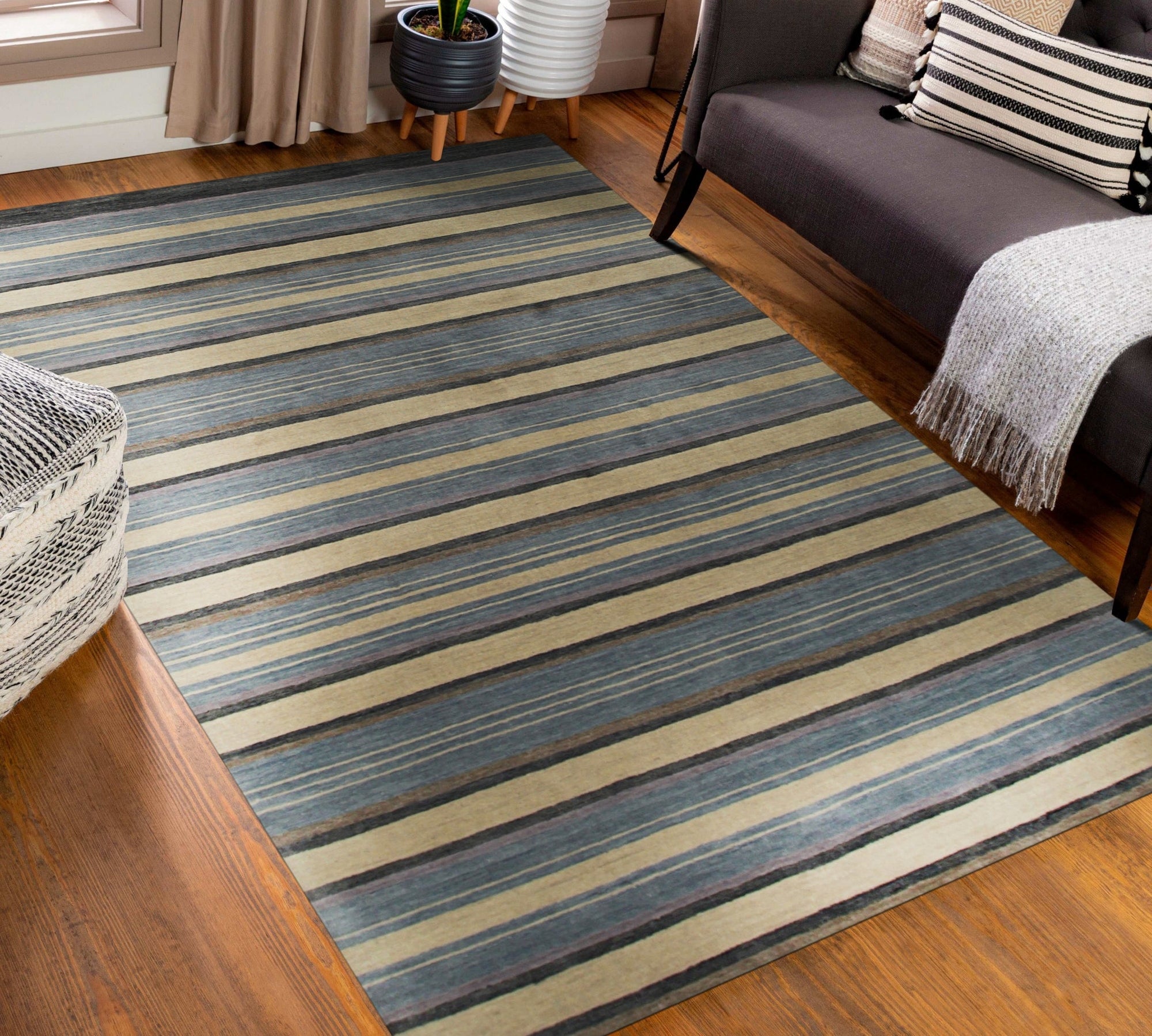 Luxurious Willow Multicolor Handmade Wool Rug displayed on a light wood floor, its vibrant palette of blues, greens, and earthy tones creating a warm and inviting atmosphere.