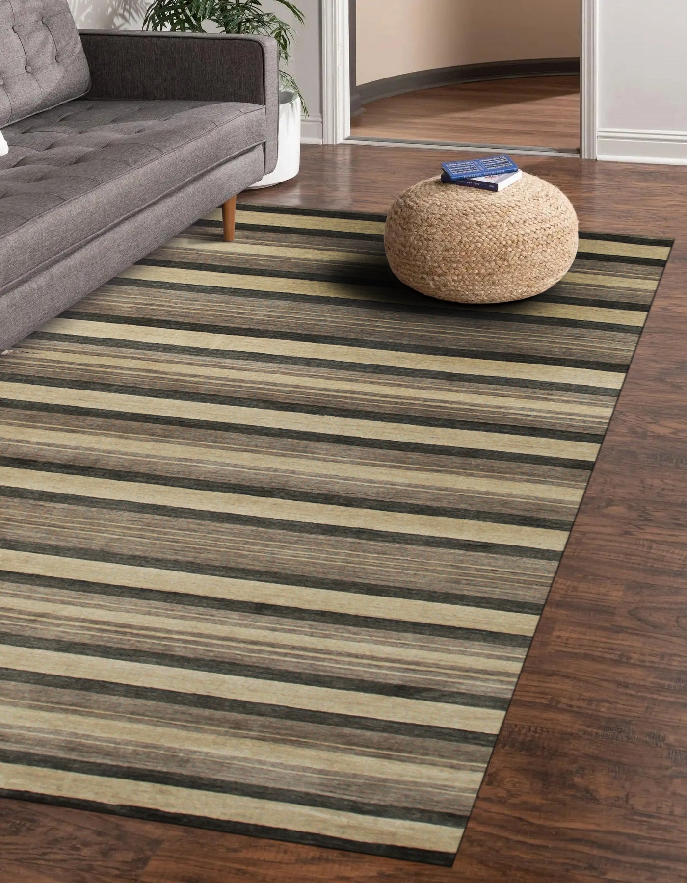 Serene Striped Multicolor Handmade Wool Rug, warm hues blending across textured wool, fills a bright room, inviting comfort and adding visual interest to the living space.
