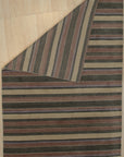 Enchanting Xena Multicolor Handmade Wool Rug, vibrant geometric patterns dance across a wool rug, bringing a burst of color and handcrafted texture to a modern living space.