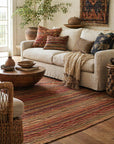 Lush Striped Red Flatweave Wool Rug styled in a bohemian living room - area rug lifestyle photo