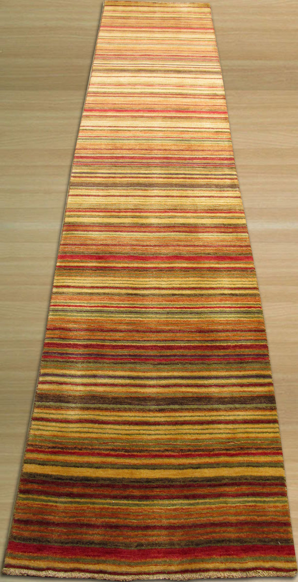 Lush Striped Red Flatweave Wool Rug, presenting bold red stripes against a neutral backdrop in a bright, airy living space. The flatweave wool construction offers a textured, yet low-profile, layer to the room.