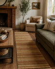 Ella Rustic Orange Handmade Wool Runner Rug 2x6 in a bright living room - orange striped runner rug