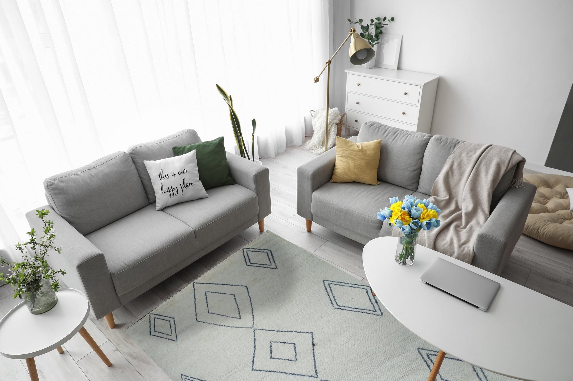 Selene Moroccan Ivory Hand Knotted Wool Rug, its soft ivory tones and textured knots lending warmth to a modern living room setting.