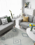 Selene Moroccan Ivory Hand Knotted Wool Rug, its soft ivory tones and textured knots lending warmth to a modern living room setting.