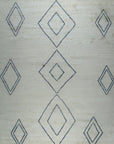 Isolated view of Selene Moroccan Ivory Hand Knotted Wool Rug, showcasing its intricate geometric pattern.